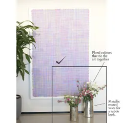 And here is how we made it right. By choosing muted metallic vases and selecting floral colors that tie into the artwork, the entire setup feels harmonious and intentional. This simple switch creates a much more sophisticated and balanced look.