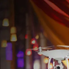 A close-up of my DJI drone in flight during an evening event. It's designed to be unobtrusive while capturing stunning, high-quality footage from above.