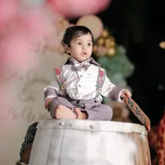 The birthday boy looking dapper and thoughtful during his circus-themed party. I focus on capturing your child's personality, even in the midst of a big celebration.