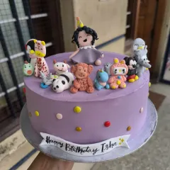 This super cute cake was for my niece's first birthday. It features her surrounded by all her favorite toys, handcrafted from fondant, including a panda, giraffe, and teddy bear.