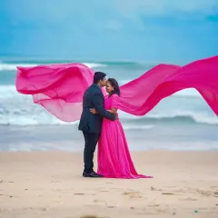 A romantic beach pre-wedding shoot. I provided this beautiful pink gown with a long, flowing trail that looks incredible against the ocean waves, along with full makeup and hair styling.