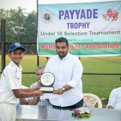 Recognizing individual excellence at the U-16 Payyade Trophy. One of our club officials presents an award to a young player for his outstanding performance during the selection tournament.