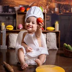Welcome to the little chef's kitchen! This is one of my most popular creative themes, complete with a miniature kitchen backdrop, chef's hat, and fun props for your baby to interact with, resulting in adorable and playful photographs.