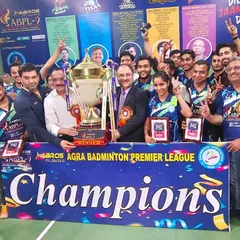 The winning team, including our Head Coach, celebrating their championship victory at the Agra Badminton Premier League. We lead by example, embodying the spirit of champions.