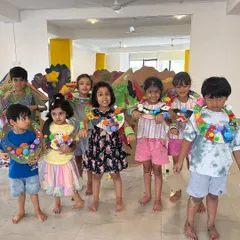 Look at these proud creators from our summer art jam. They designed and made their own wearable art, showing off the colorful necklaces they crafted during a session focused on personal expression and accessory design.