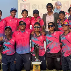 The victorious team posing with the trophy and a mentor. We believe in celebrating our successes together as one big family.