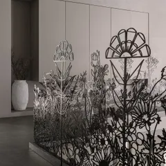 The delicate yet strong forms of the metal railing create a beautiful screen that allows light to pass through. This piece demonstrates how functional safety features can also be exquisite works of art.