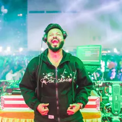 A candid shot from a corporate event. Even in a formal setting, the joy of music is universal.