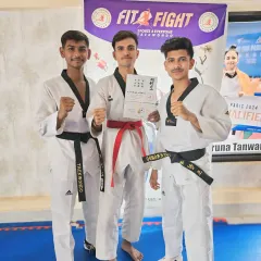 Three of our senior students proudly display their new belts and certificates after a successful promotion exam. Their progress shows the path for our junior members.