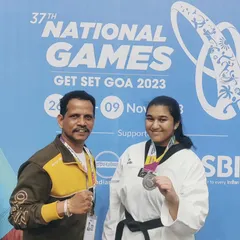 A proud moment coaching at the 37th National Games in Goa. Here I am with one of our state's top athletes after she won a silver medal. We prepare our students to compete and succeed at the highest levels of the sport.