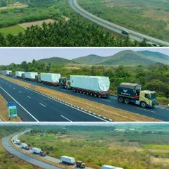 An aerial perspective of a Varsha Logistics convoy navigating the highway in Madurai. These wide shots are perfect for showcasing the scale and reach of a logistics company's operations.