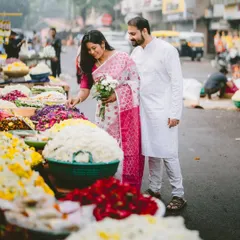 A morning stroll through a bustling flower market in Pune. This shot captures the couple in a real-life setting, surrounded by the vibrant colors and textures of the city.
