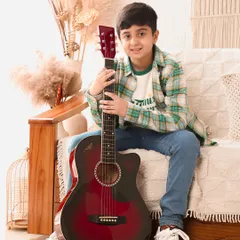 A portrait of a young musician. This simple, classic shot of a boy with his guitar captures his passion and quiet confidence.