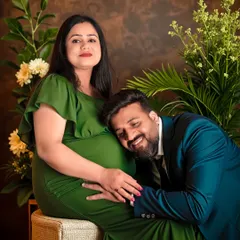 A sweet and loving pose with the dad-to-be listening to the baby bump. This classic couple's maternity pose is always a favorite for capturing the connection before the baby arrives.