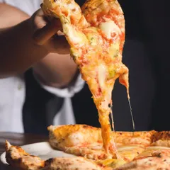 We're all about that perfect cheese pull. Our Quattro Formaggi is a celebration of cheese, with a stretchy, gooey texture that's pure happiness in a slice.