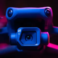 A dramatic close-up of the Hasselblad camera lens on our DJI Mavic 3 drone, highlighting the professional-grade imaging technology we employ.