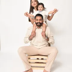 A fun and playful family pose. Having your child on your shoulders always brings out the biggest smiles from everyone.