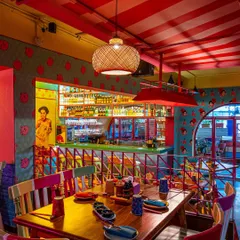For The Fatty Bao, the goal was to capture its vibrant, high-energy personality. This shot highlights the eclectic mix of colors, from the red-striped ceiling to the pop-art graphics and the brightly lit bar, showing how I capture the unique character of a brand.