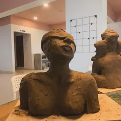 A student's work from our sculpture workshop, capturing a moment of quiet contemplation. The blindfolded figure, with its head tilted upwards, evokes a powerful sense of inner searching and trust.