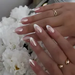 A modern take on a timeless classic. These elegant almond nails feature a pearlescent chrome finish over a natural base with crisp white French tips. This design offers a sophisticated and clean look, ideal for weddings, formal events, or elevating your everyday style.