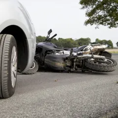 This image of a motorcycle accident is a stark reminder of what's at stake. If you've been hurt, I am the lawyer that cares and will fight for your rightful claim.