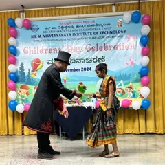 A young volunteer from the audience helps me with a flower trick during a school performance. Interactive magic is the best way to make the show memorable for students.