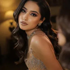 A close up portrait showcasing a soft retro wave look. The gentle S-shape waves frame the face beautifully, creating a glamorous and sophisticated style suitable for any evening event.