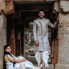 For a traditional and regal look, I offer this stunning sherwani and dhoti set. The intricate design and classic silhouette are perfect for pre-wedding ceremonies or a cultural photoshoot.