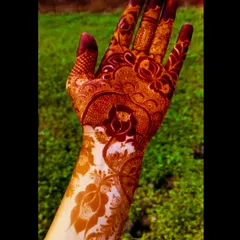 A full-hand design after the paste has been removed, showing a deep and even brown stain.