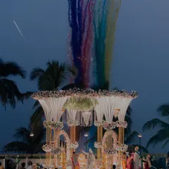 We specialize in capturing the grandeur of your wedding day. This shot from a Maharashtrian beach wedding shows how we frame the scale and beauty of your ceremony, creating an image that is both epic and personal.