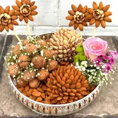 This stunning dry fruit platter is a work of art. I meticulously arrange almonds, walnuts, and pistachios to create beautiful floral patterns, making it a healthy and impressive gift for any occasion.