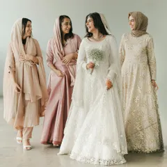 A beautiful portrait of the bride, Shifa, with her bridesmaids, all dressed in elegant, coordinated outfits for her Nikkah ceremony. Their smiles and camaraderie are heartwarming.
