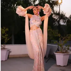 A dramatic pose in a pastel peach fusion gown. I styled this with voluminous sleeves and intricate floral embroidery for a high-fashion, European-inspired look.