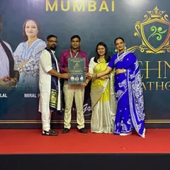 On stage in Mumbai, receiving recognition for my participation in a mehndi competition. Continuous learning is key in our art.