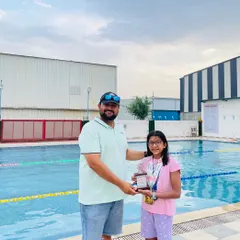 Presenting the 'Best Swimmer' trophy to Yuvika Sharma after she won 5 gold medals at an Inter-School meet. Mentoring young talent and watching them succeed is the most rewarding part of my job.
