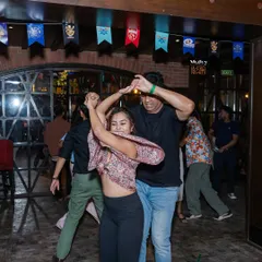 A candid shot from our La-Fro Nights social. This is where you put what you learn in class into practice, in a real, fun, and supportive party environment.