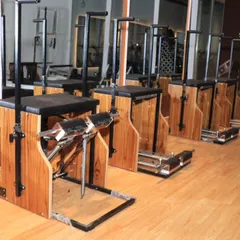 A look at our row of Pilates Wunda Chairs. This versatile piece of equipment is used for a wide range of exercises to challenge your strength and balance.