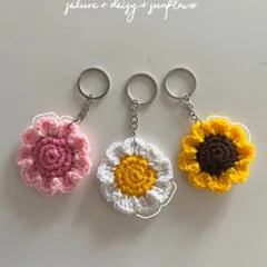 A vibrant set of my most popular flower keychains: a pink sakura, a classic white and yellow daisy, and a sunny sunflower. These add a pop of color to anything.