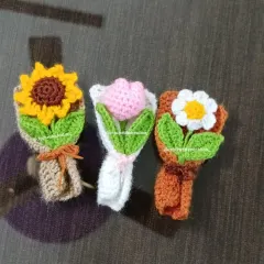 A trio of our extra-small (XS) bouquets: a sunflower, a pink tulip, and a white daisy. Each one is a tiny work of art.