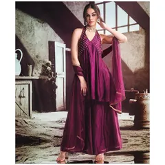 A full view of a gorgeous magenta sharara set with a halter-neck top. This is a fantastic choice for a Sangeet night, offering both comfort and a high-style, celebratory feel.