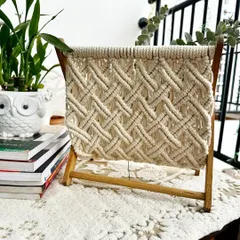 I designed this macrame magazine holder to be both beautiful and useful. It features a sturdy wooden frame and a tightly woven pocket to hold books, magazines, or newspapers, keeping your living space tidy and stylish. It’s a perfect example of functional home decor.