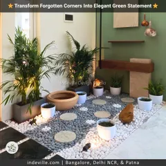 A different angle of the indoor green corner, highlighting the interplay of light and shadow. The warm lighting accentuates the textures of the plants and stones, adding depth and luxury to the space.