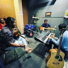 A group learning session where our instructors guide students on various instruments, creating a collaborative and fun learning environment.