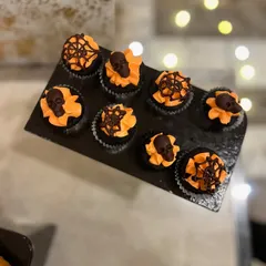Spooky and delicious Halloween-themed cupcakes I made for a party. The orange frosting and chocolate skull toppers were a big hit.