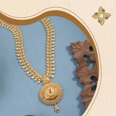 A stunning yellow gold long necklace with a large, circular filigree pendant. This piece is a perfect blend of traditional design and modern craftsmanship, ideal for festive occasions.