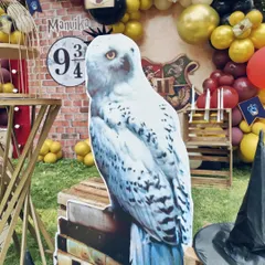A large cutout of Hedwig the owl, one of the many custom props I created for this magical Harry Potter party.