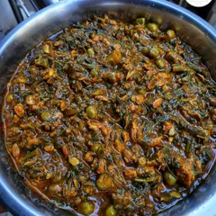 A bowl of indigenous Chagempomba, a unique and traditional Manipuri vegetarian curry made with fermented soybeans and vegetables.