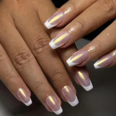 A modern update to a timeless classic. This is our glazed chrome French manicure, giving you that clean, sophisticated look with an iridescent, eye-catching finish.