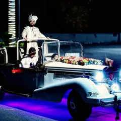 The groom's entry is a highlight of any Indian wedding, and I make sure to capture it with all its grandeur. This shot of the groom arriving in a vintage car, complete with dramatic lighting, shows my cinematic approach to documenting the baraat.