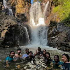 A perfect moment of bliss as our group enjoys a swim in the cool, clear waters at the base of a waterfall on our Bandaje trek.